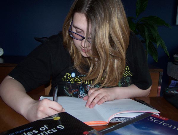 What a GOOD teenager - doing her homework!